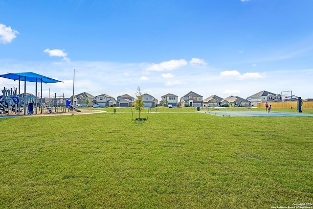2059 Olivia Dr, New Braunfels, TX 78130 - view of community with a yard, community basketball court, a residential view, and playground community