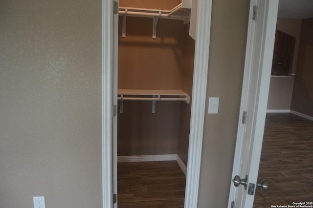 18687 Rolling Mdw, Lytle, TX 78052 - walk in closet featuring wood finished floors