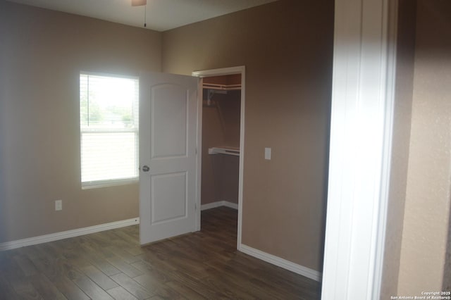 18687 Rolling Mdw, Lytle, TX 78052 - empty room with a ceiling fan, baseboards, and dark wood finished floors