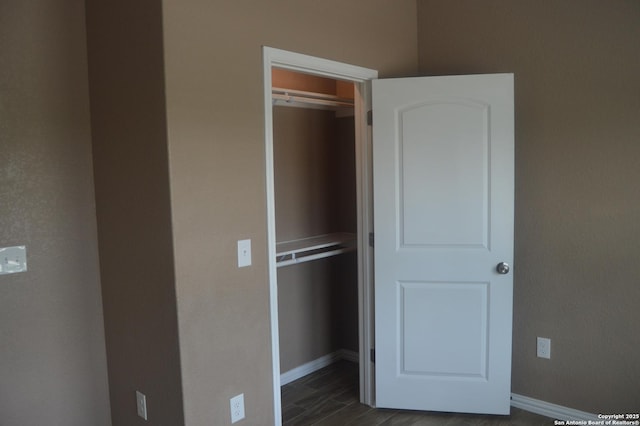 18687 Rolling Mdw, Lytle, TX 78052 - unfurnished bedroom with baseboards, a closet, and dark wood finished floors