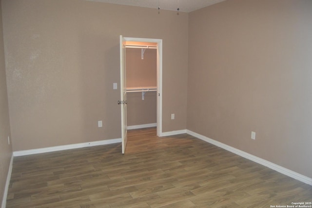 18687 Rolling Mdw, Lytle, TX 78052 - spare room featuring wood finished floors and baseboards