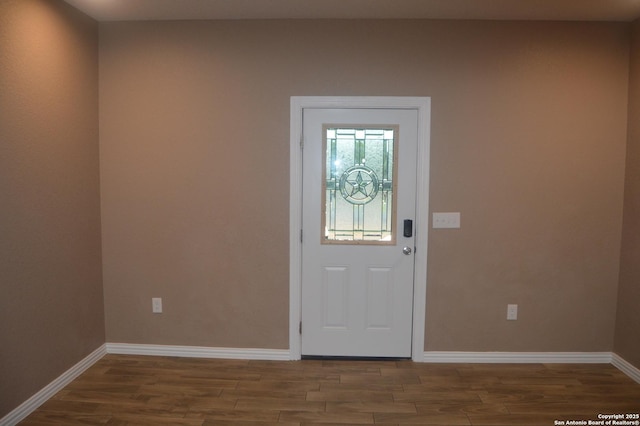 18687 Rolling Mdw, Lytle, TX 78052 - entryway featuring baseboards and wood finished floors