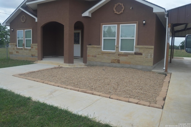 18687 Rolling Mdw, Lytle, TX 78052 - view of front of home featuring stone siding and stucco siding