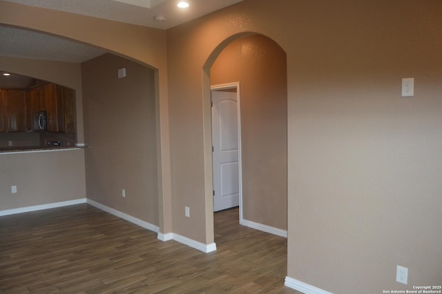 18687 Rolling Mdw, Lytle, TX 78052 - empty room featuring baseboards, wood finished floors, and recessed lighting