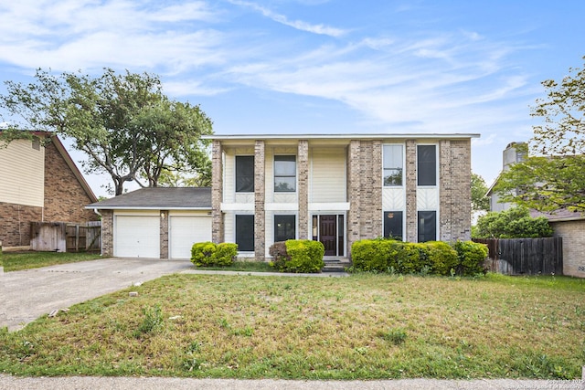 view of front of home with fence, an attached garage, a front lawn, and driveway