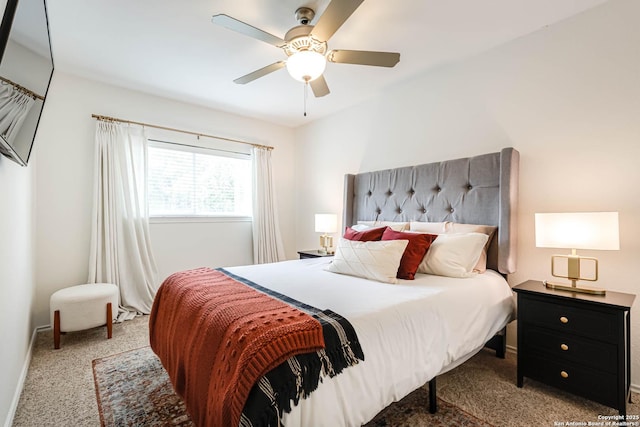 carpeted bedroom featuring ceiling fan and baseboards