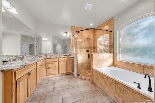 full bathroom featuring a sink, a stall shower, a bath, double vanity, and visible vents