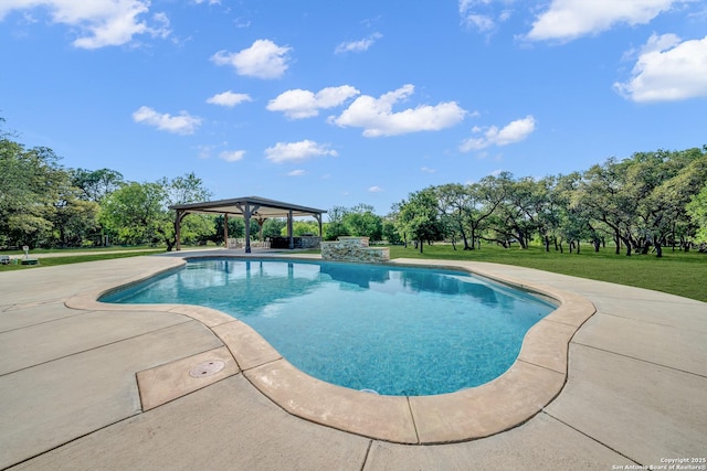 outdoor pool with a patio area, a gazebo, and a yard