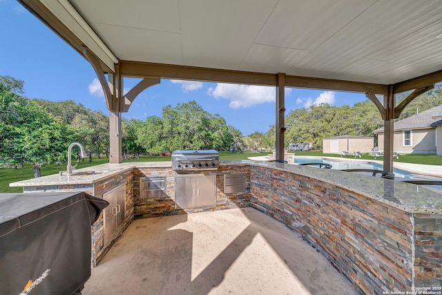 view of patio / terrace with a sink and area for grilling