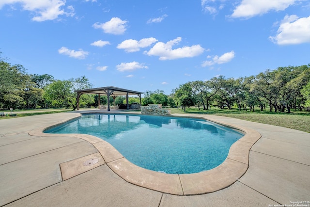 outdoor pool with a gazebo and a patio