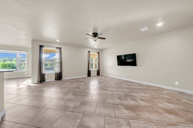 unfurnished room featuring ceiling fan, baseboards, visible vents, and recessed lighting