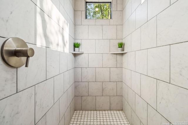 bathroom with tiled shower