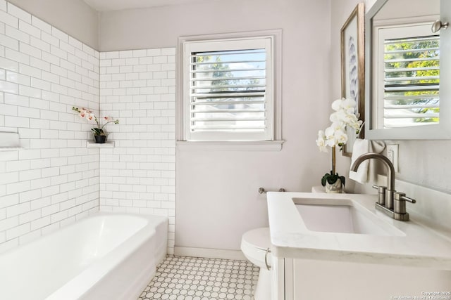 bathroom featuring toilet and vanity