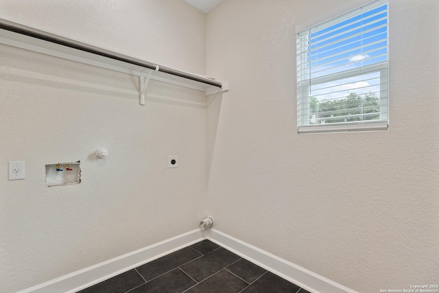 114 S Minter St, San Antonio, TX 78207 - washroom with laundry area, hookup for an electric dryer, dark tile patterned floors, gas dryer hookup, and baseboards
