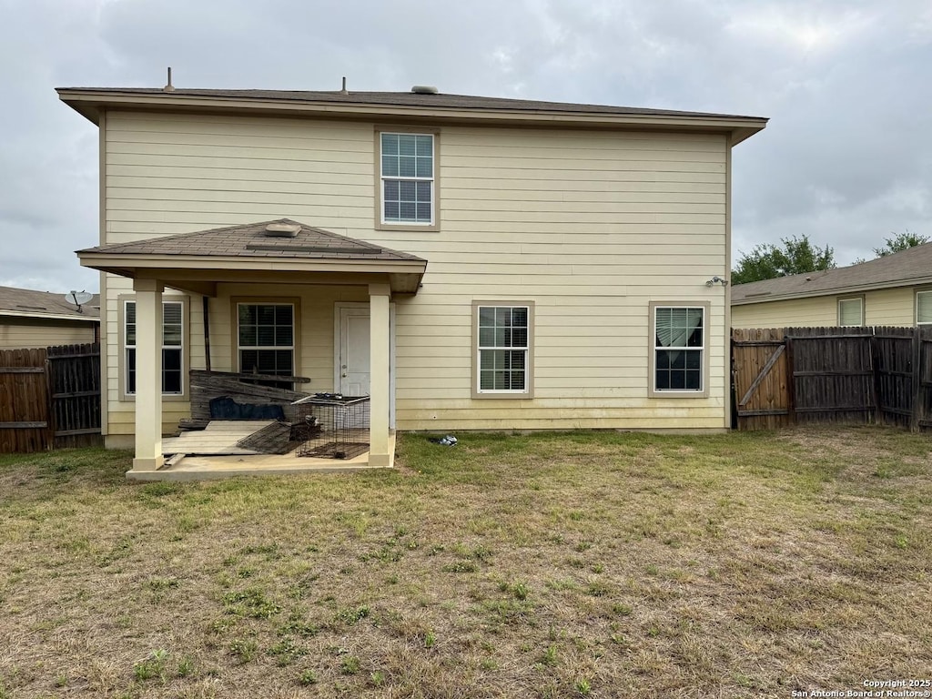 814 Six Iron, San Antonio, TX 78221 - rear view of property featuring a fenced backyard, a patio area, and a lawn