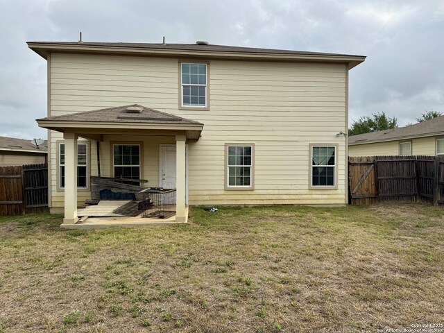 814 Six Iron, San Antonio, TX 78221 - rear view of property featuring a fenced backyard, a patio area, and a lawn