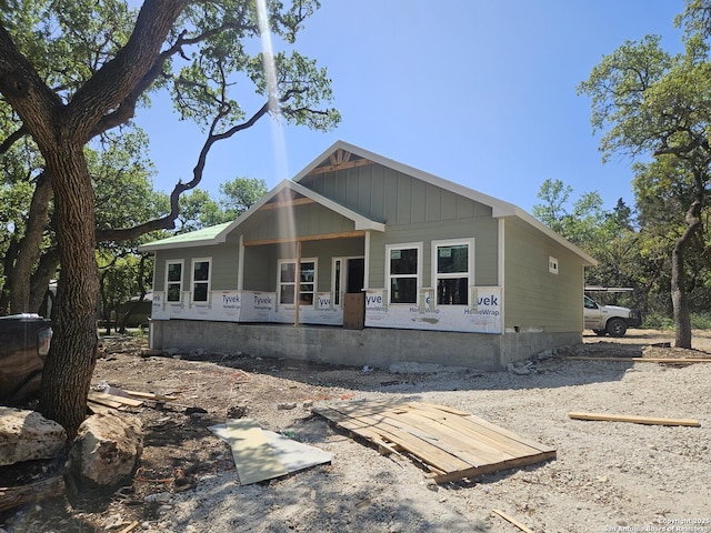 894 Luehlfing, Canyon Lake, TX 78133 - view of front facade featuring board and batten siding and covered porch
