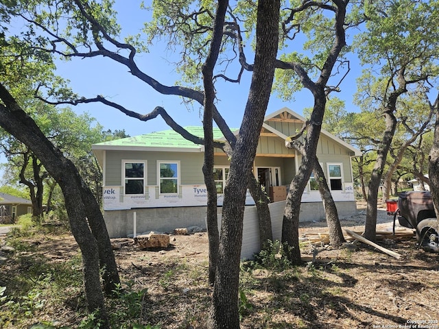 894 Luehlfing, Canyon Lake, TX 78133 - view of side of property with board and batten siding