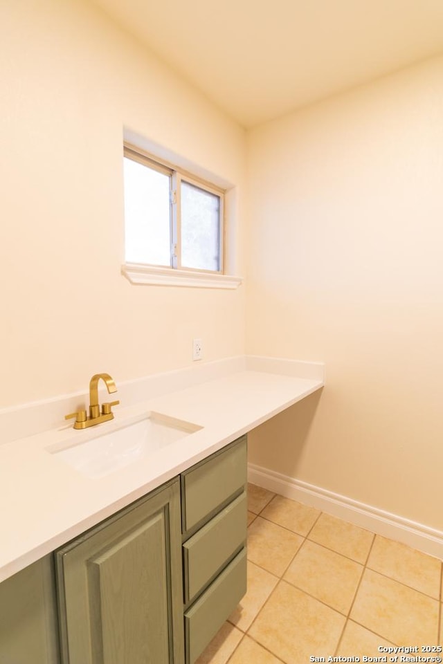 905 E Inez, Beeville, TX 78102 - bathroom with baseboards, tile patterned floors, and vanity