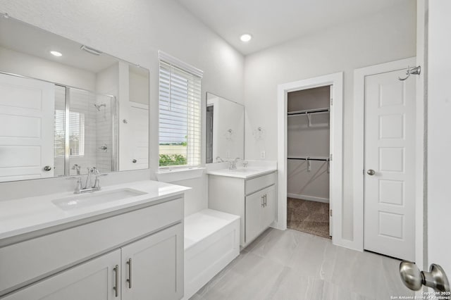 6031 Calgary Park, San Antonio, TX 78233 - full bath featuring a stall shower, two vanities, recessed lighting, a spacious closet, and marble look tile flooring