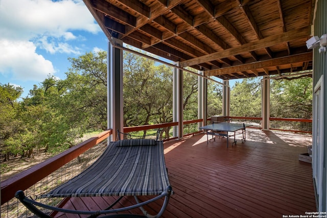 wooden terrace with outdoor dining area
