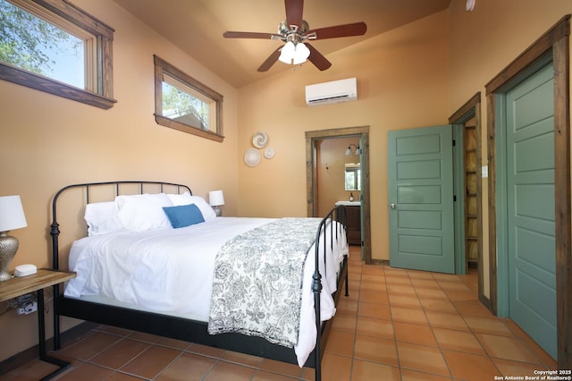 bedroom featuring an AC wall unit, a ceiling fan, and tile patterned flooring