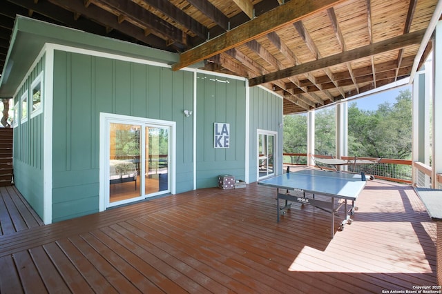 wooden terrace with outdoor dining space
