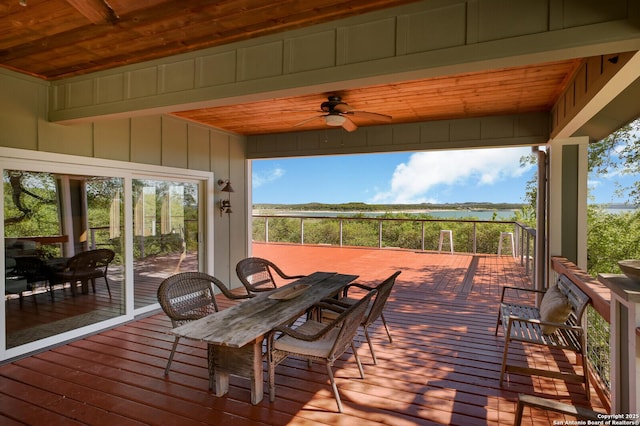 wooden deck featuring a ceiling fan and outdoor dining space