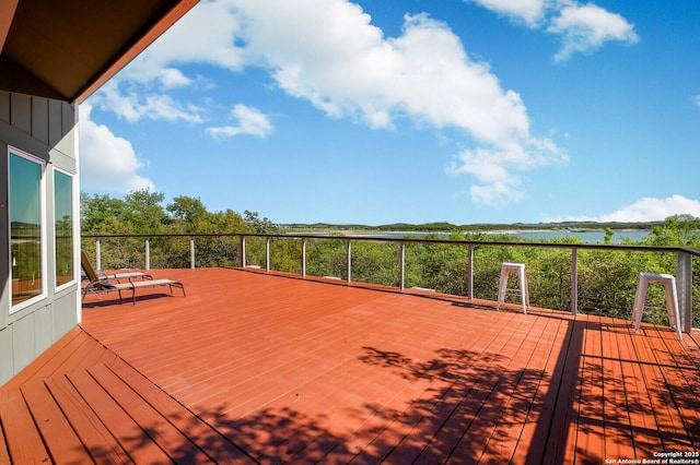 wooden deck with a water view