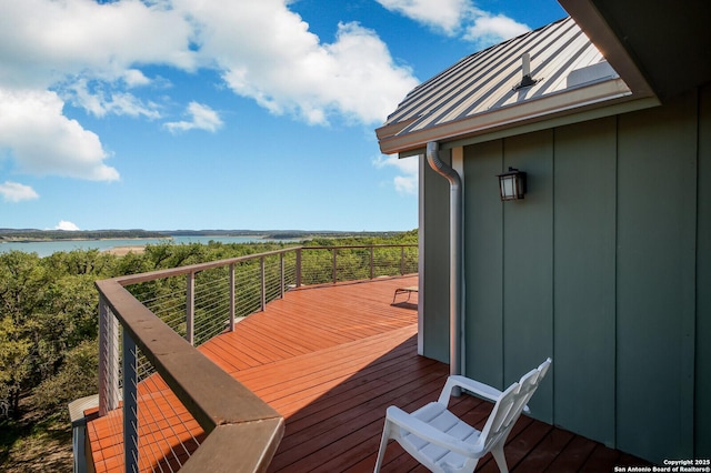 wooden deck featuring a water view