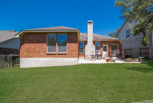 1106 Crystal Spg, San Antonio, TX 78258 - rear view of property featuring a lawn, a patio area, and a fenced backyard
