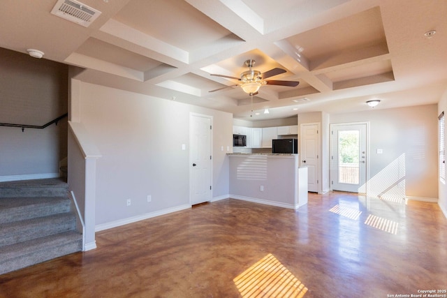 unfurnished living room with coffered ceiling, visible vents, beamed ceiling, baseboards, and ceiling fan