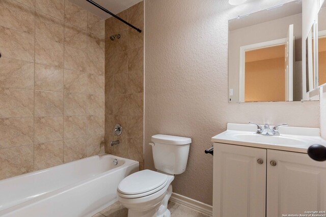 bathroom with vanity, tub / shower combination, a textured wall, baseboards, and toilet