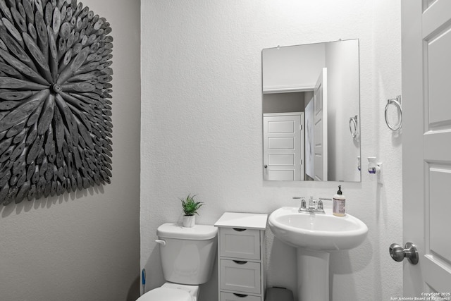 bathroom featuring toilet