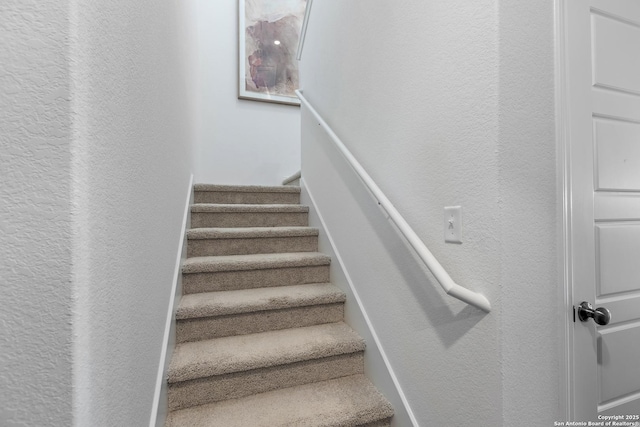 stairs with a textured wall
