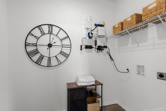 laundry area with hookup for an electric dryer, dark wood-style flooring, baseboards, washer hookup, and laundry area