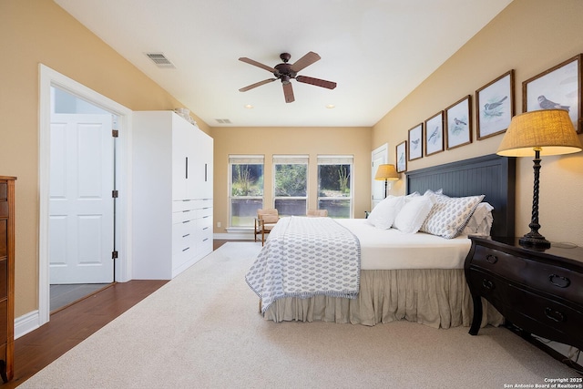 bedroom featuring ceiling fan, wood finished floors, visible vents, and recessed lighting