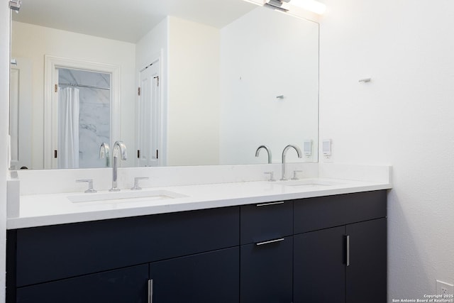 full bath with double vanity and a sink