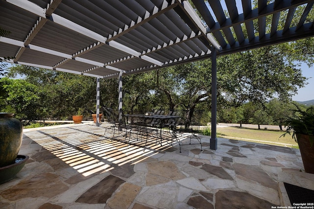 view of patio with a pergola and outdoor dining space