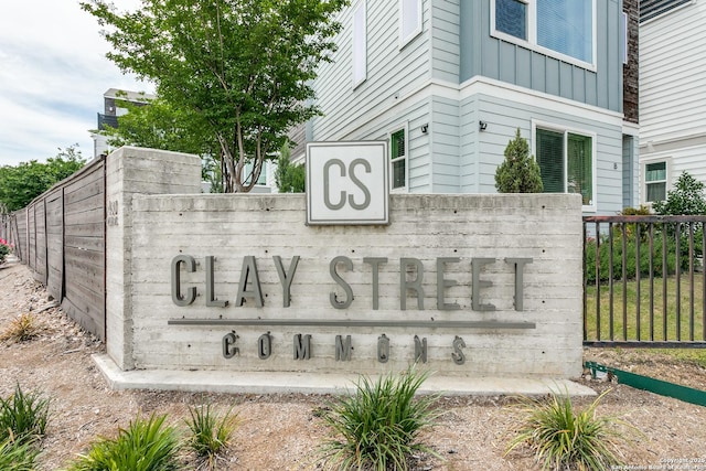 community sign featuring fence