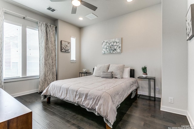 bedroom featuring baseboards, dark wood-style flooring, visible vents, and recessed lighting