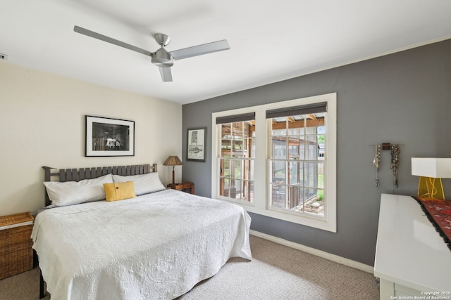 bedroom featuring a ceiling fan, baseboards, and carpet floors
