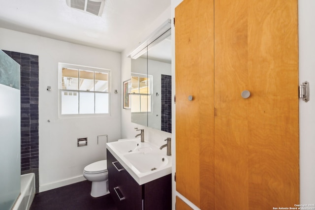 bathroom with baseboards, visible vents, a sink, and toilet