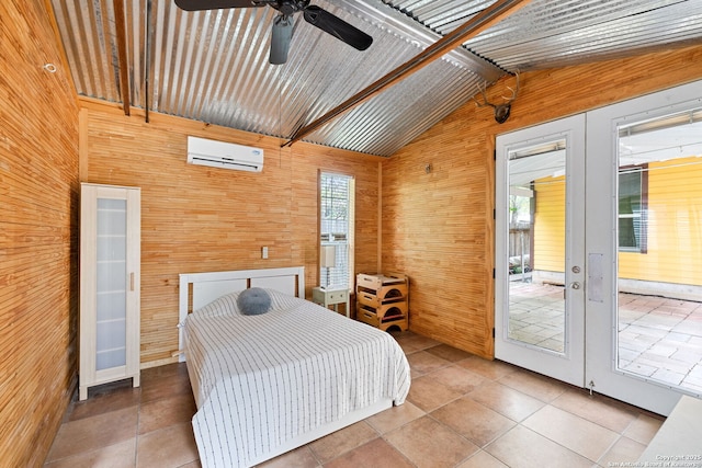 bedroom featuring french doors, wooden walls, a wall mounted AC, and vaulted ceiling