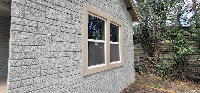 view of home's exterior featuring fence