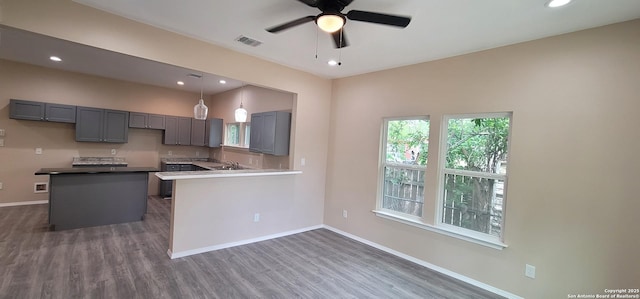 kitchen featuring ceiling fan, baseboards, gray cabinetry, and visible vents