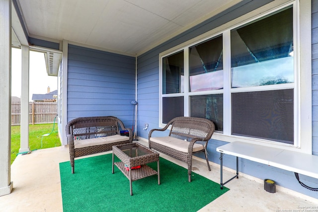 view of patio / terrace with outdoor lounge area and fence