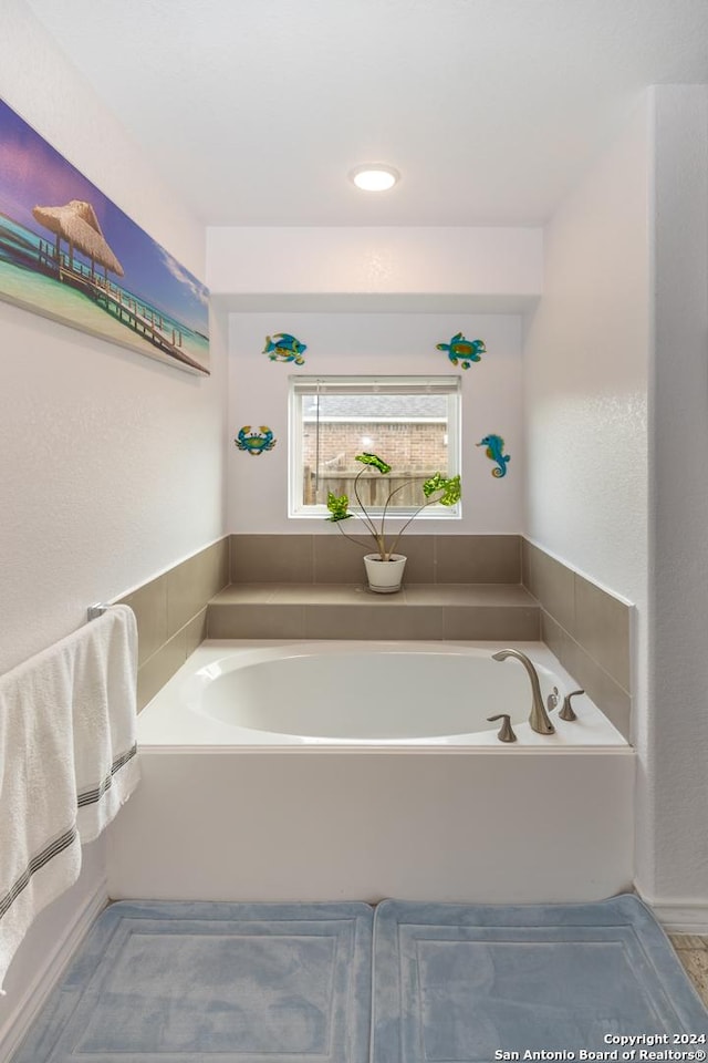bathroom featuring a bath