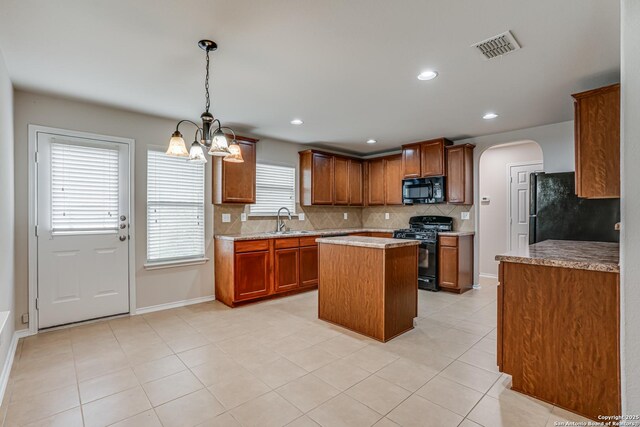 342 Perch Horizon, San Antonio, TX 78253 - kitchen with visible vents, a sink, black appliances, a chandelier, and tasteful backsplash