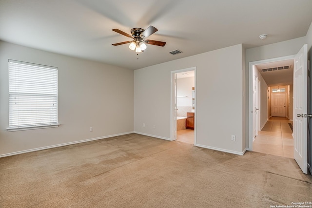 342 Perch Horizon, San Antonio, TX 78253 - unfurnished bedroom featuring ensuite bath, visible vents, baseboards, and light carpet